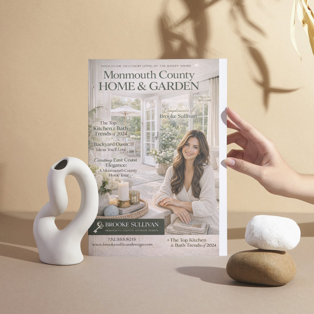Monmouth County Home & Garden magazine with a woman on the cover, held by a hand against a beige background.